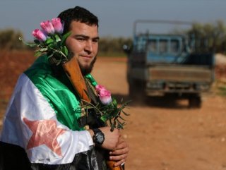 Civilians in Afrin were welcomed with flowers by FSA